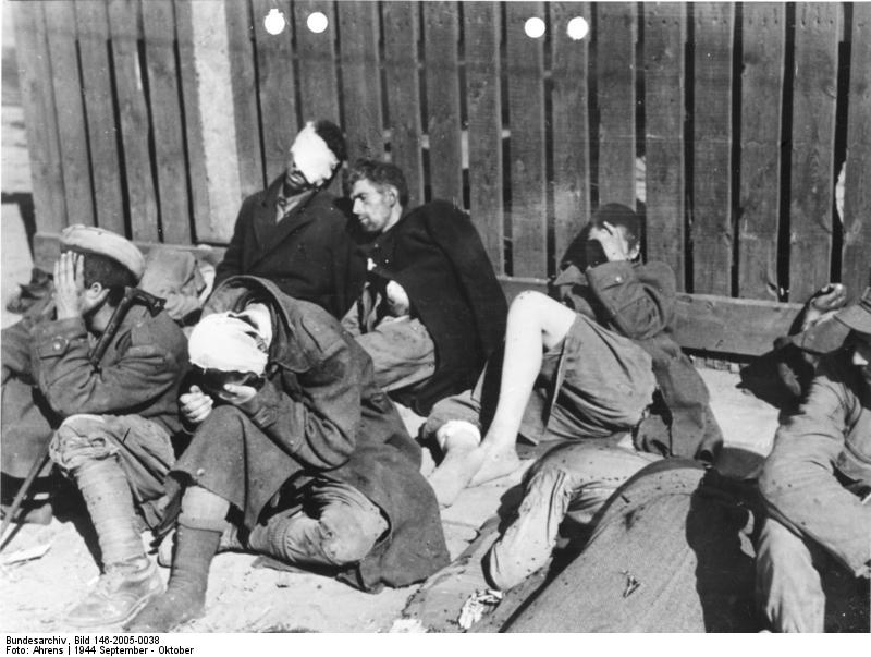 In the picture we see insurgents and 1st Polish Army's soldiers taken prisoner after the fall of Czerniaków district. Photo credit: Bundesarchiv, Bild 146-2005-0038 / August Ahrens / CC-BY-SA 3.0
